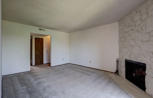 Clean Top Floor 1BR 1BA Condo with Wood Burning Fireplace