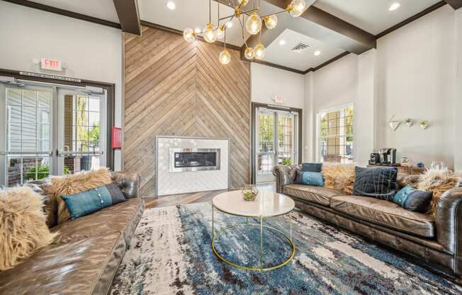 a living room with couches and a fireplace