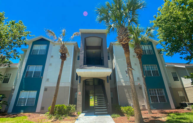 Apartment building exterior with palm trees