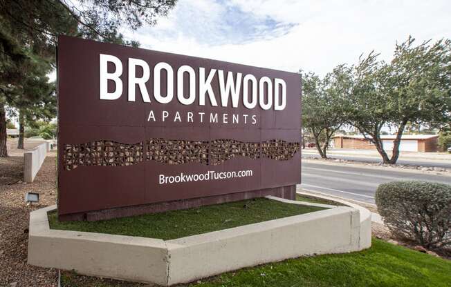 a sign for brookwood apartments is shown in front of a street