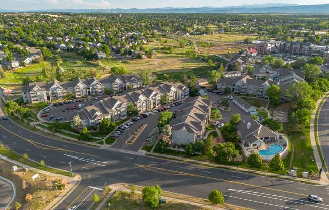 an aerial view of a neighborhood of houses on a street