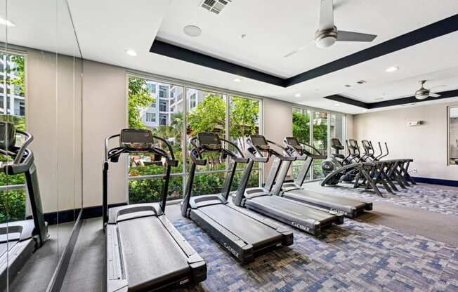 Well-equipped fitness studio with treadmills at Harlow River Oaks apartments in Houston, TX