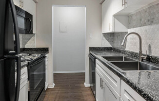 a kitchen with a stove and a sink