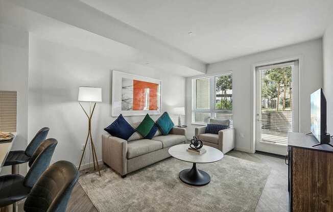 Living room with TV at Bayview Apartments, Emeryville, CA