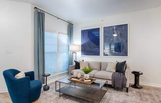 a living room with a couch coffee table and chairs