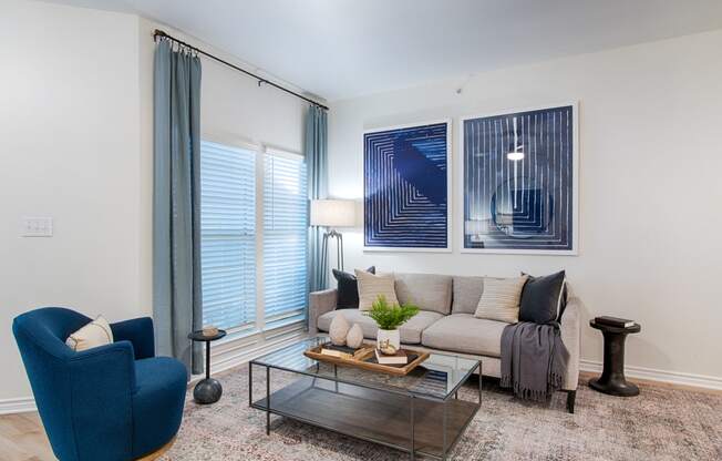 a living room with a couch coffee table and chairs