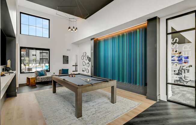 a spacious living room with a pool table in the middle of the room at Prism at Diamond Ridge, Moon Township, Pennsylvania