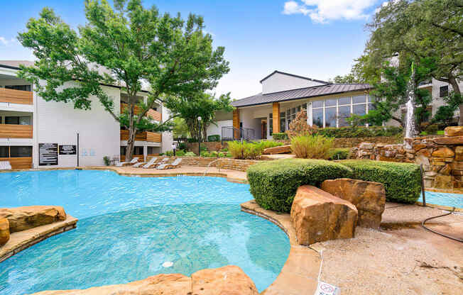 the preserve at ballantyne commons community pool and spa with lounge chairs and trees