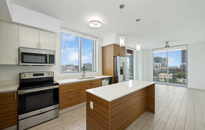 a kitchen with white countertops and wooden cabinets