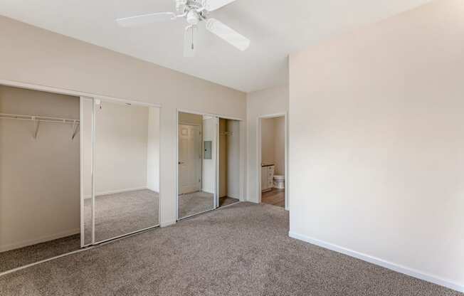 Bedrooms at Ascent at the Galleria come with cozy carpeting and ceiling fans, providing comfort and a relaxing atmosphere in every home.