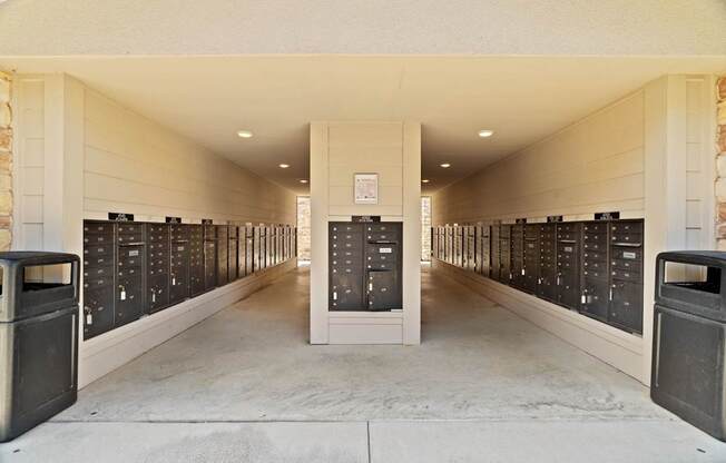 A long hallway with a row of lockers on each side.
