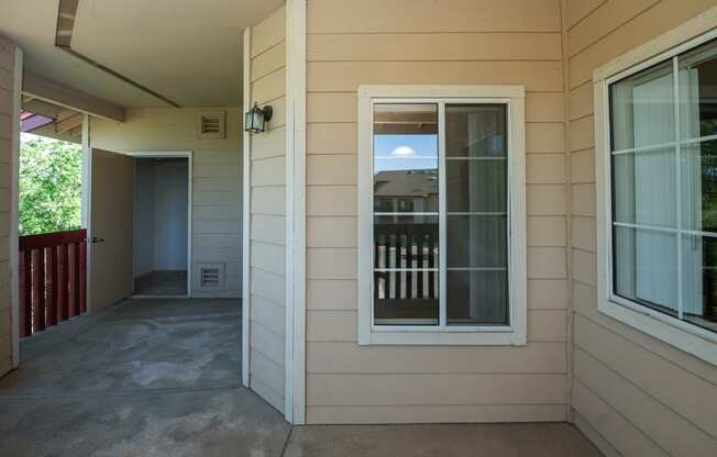 a view of the front porch of a house with a window