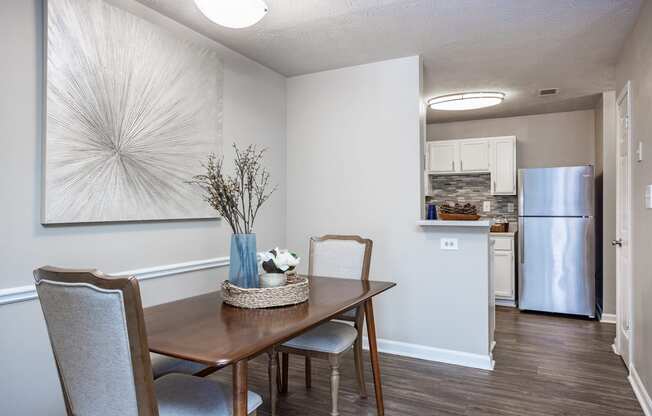 an open kitchen and dining room with a table and chairs