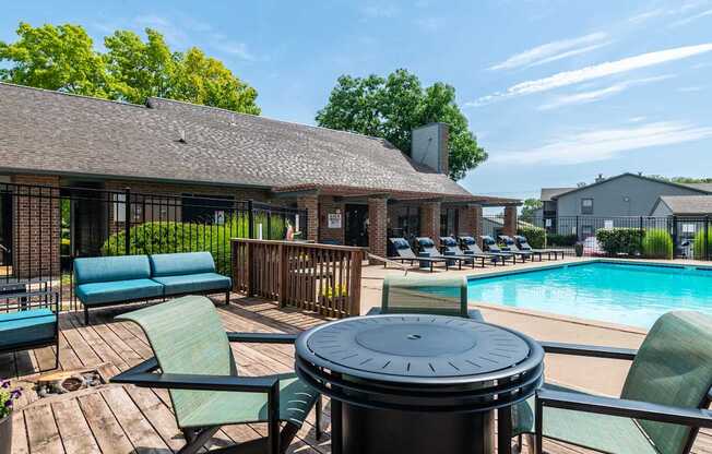 Poolside area with seating at Springhill Apartments, Overland Park, Kansas