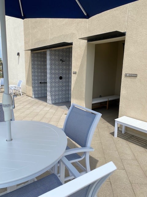 a patio with a table and chairs and an umbrellaat Westbury Apartments, Rancho Cucamonga, 91739