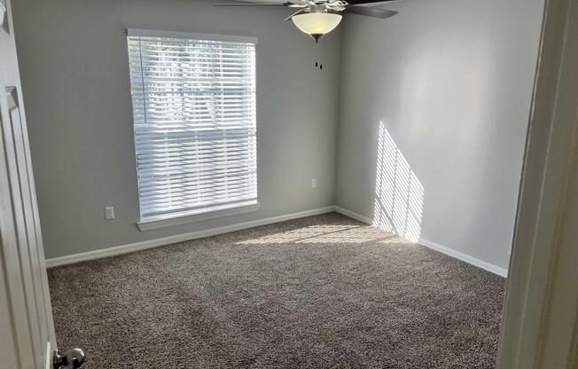 a bedroom with a large mirror