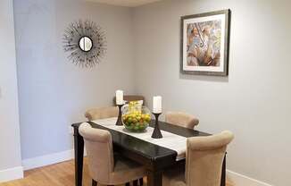 A dining room with a table set for two at Woodley Sara Apartment, Van Nuys, 91406