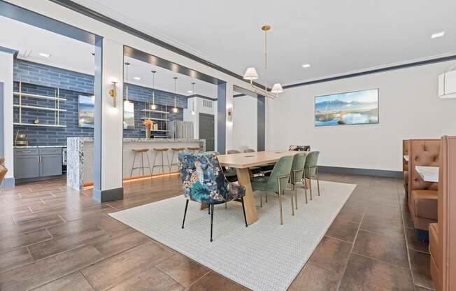 A modern dining room with a wooden table and chairs.
