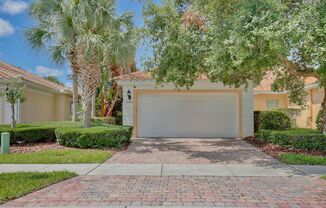 Gorgeous 2/2 + Den Mediterranean Villa with Waterfront Screened Patio and 2-Car Garage in the Prestigious VillageWalk at Lake Nona Community!