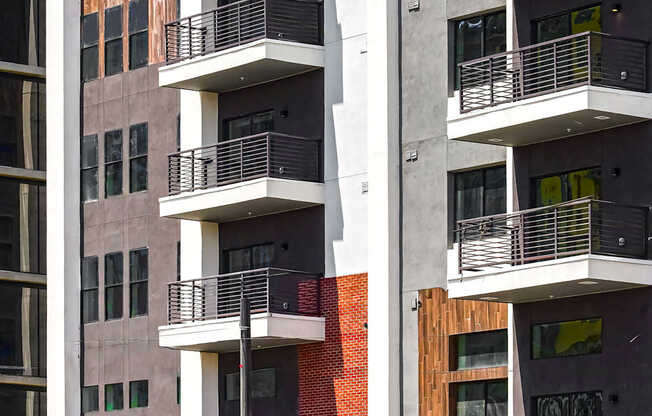 A modern building with balconies and windows.