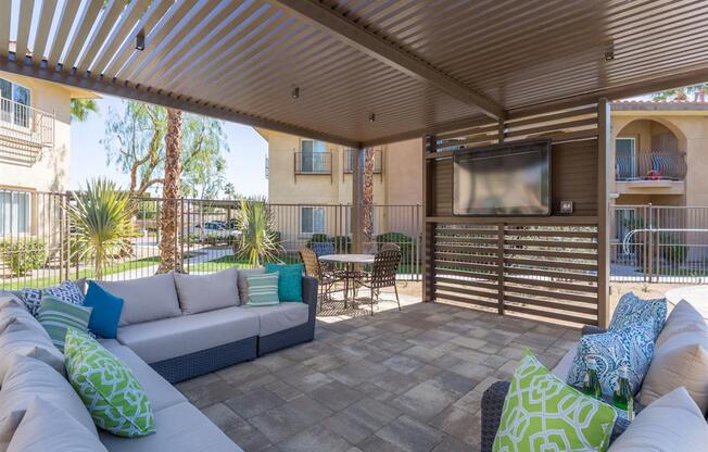 Outdoor Lounge Area With TV at Medici Apartment Homes, California, 92203