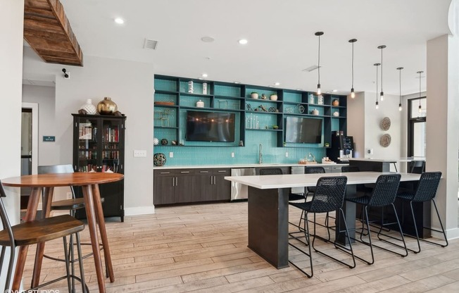 a kitchen and dining area with a table and chairs