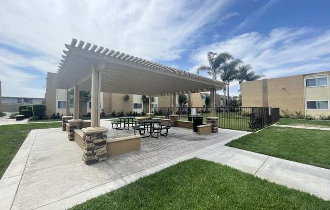 Dog Park and Outdoor Shaded Seating at Whiffle Tree Apartment homes in Huntington Beach, CA.