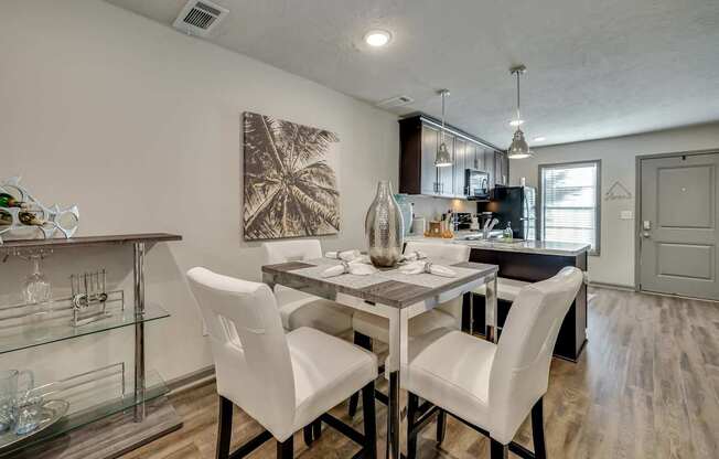 an open kitchen and dining room with a table and chairs