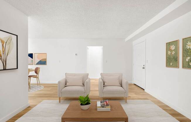 a living room with two chairs and a coffee table