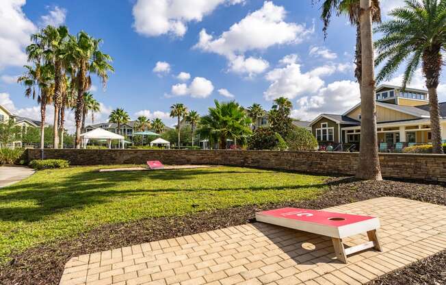 outdoor grass area with corn hole