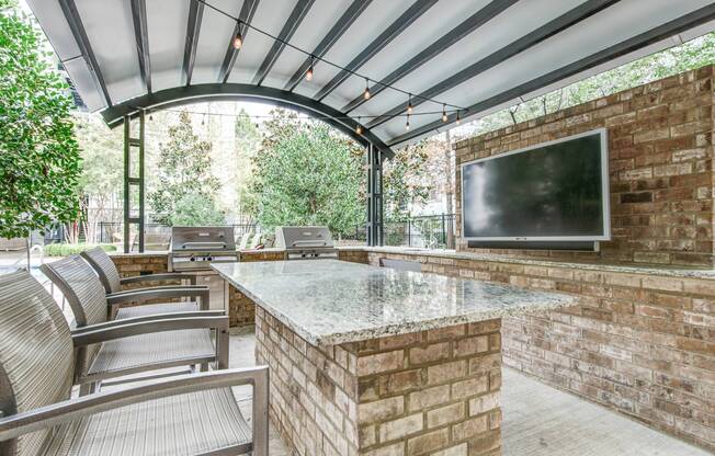 Outdoor BBQ area outside pet-friendly apartments in Atlanta, GA.
