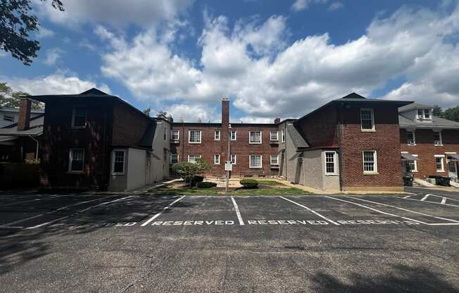 an empty parking lot in front of a brick building  at Cincinnati Premier Living*, Cincinnati, Ohio