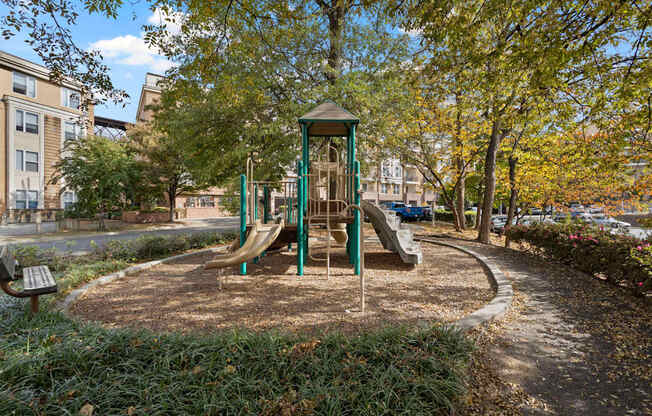 The playground at Ten05 West Trade Apartments, set up on mulched wood.