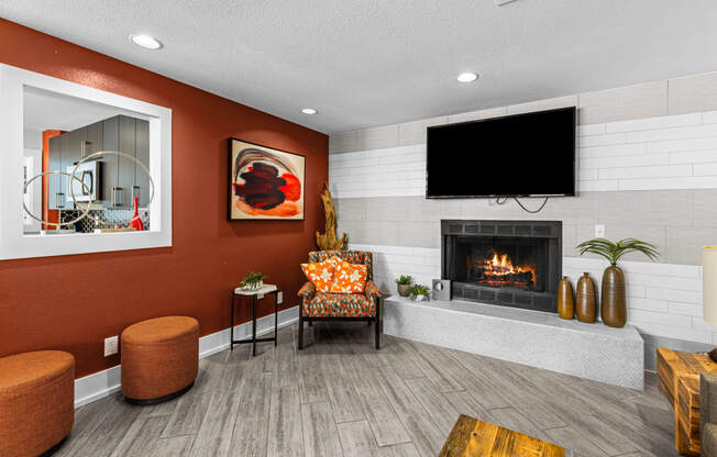 a living room with a fireplace and a tv