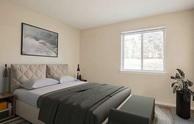 a bedroom with a large bed and a large window