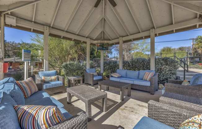 a patio with couches and chairs and a gazebo  at Sunset Ridge, San Antonio, TX