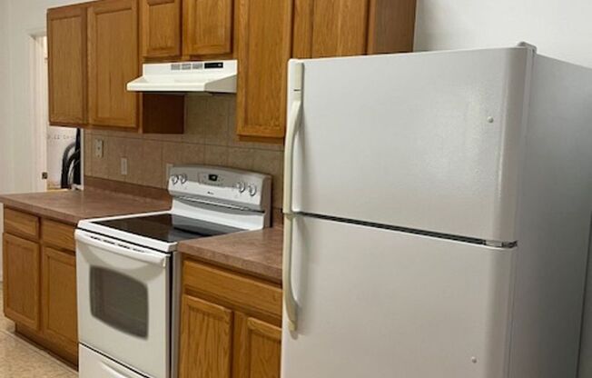 Beautiful 3/2/2 house with laminate floors, tiles, screen porch, luscious lawn, sprinkler system and much more.