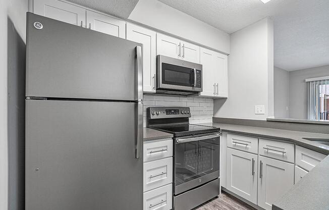 a stainless steel refrigerator in a kitchen