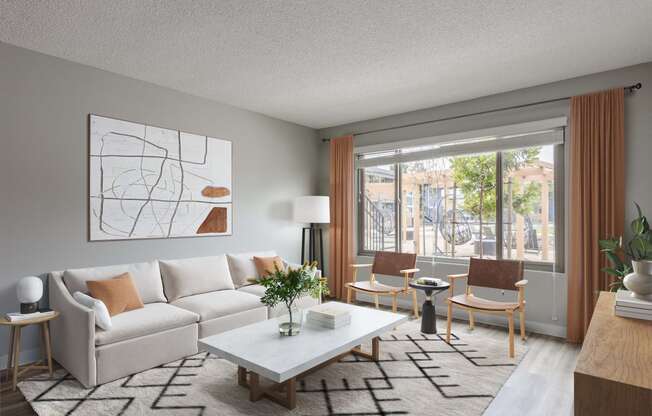 a living room with a white couch and a table