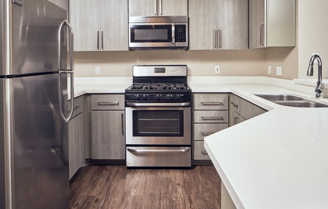 Apartments for Rent in Escondido, CA - Alta Vista Kitchen with stainless steel appliances, and modern wood cabinets