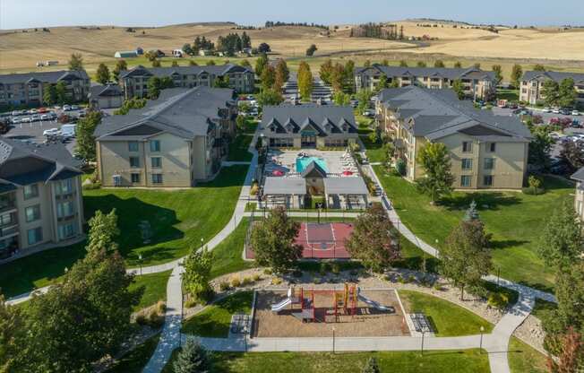 an aerial view of a neighborhood with houses and a playground