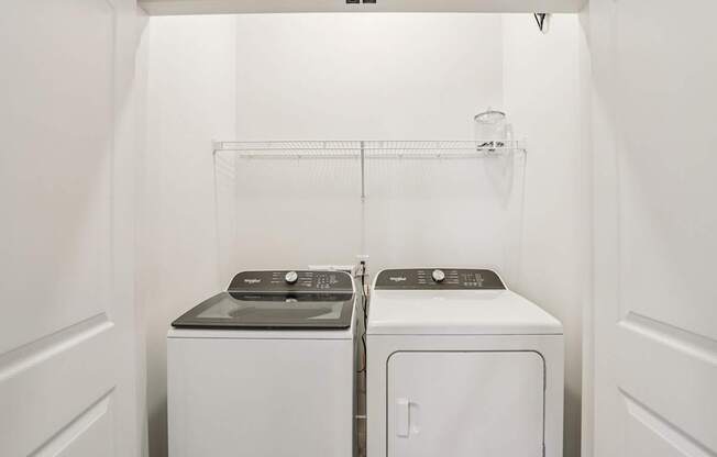 A laundry room with a washer and dryer.
