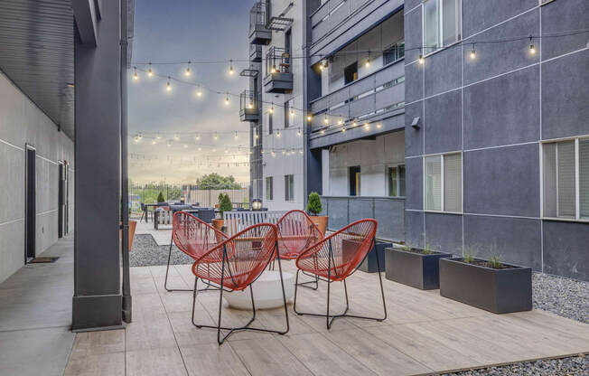 a communal area with chairs and tables in an office building