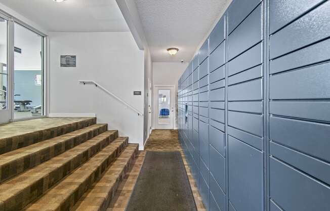 Riverwood self service package lockers and stairs to gym