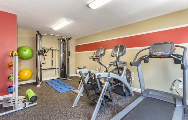 Fitness center with treadmill, elliptical, recumbent bike, cable machine and medicine balls, and foam roller at Pacific Sands, San Diego, CA, 92117