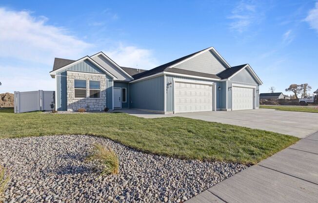 BRAND NEW TWIN HOME WITH XL GARAGE AND FENCED YARD