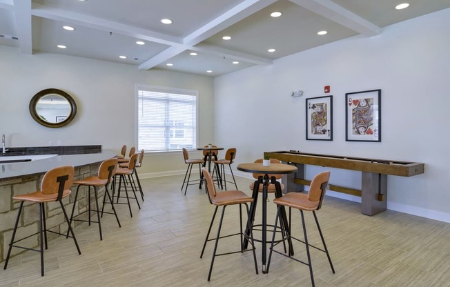 Ashland Farms Clubhouse Social Room with Shuffleboard and Various Table Seating