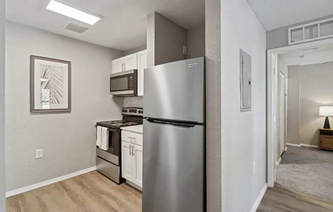 a kitchen with a refrigerator and a stove and a microwave at Reserve at Temple Terrace, Florida, 33637