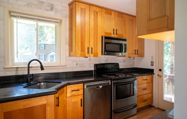 Charming Split-Level Home with Bright Interiors and Spacious Backyard