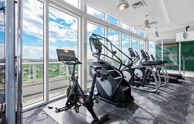 A gym with a view of the city.